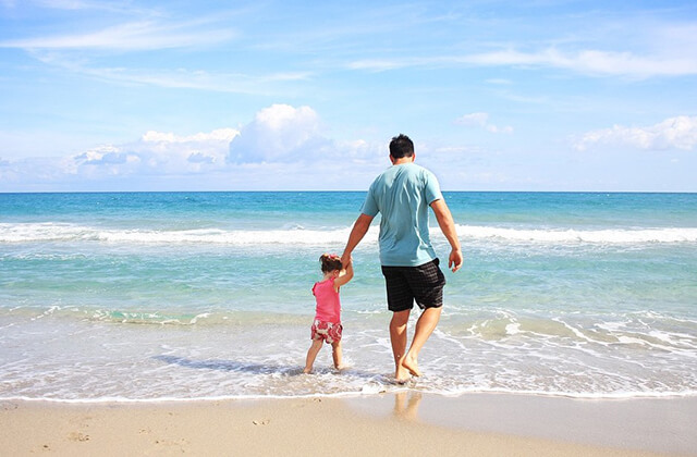 Father and child on the beach